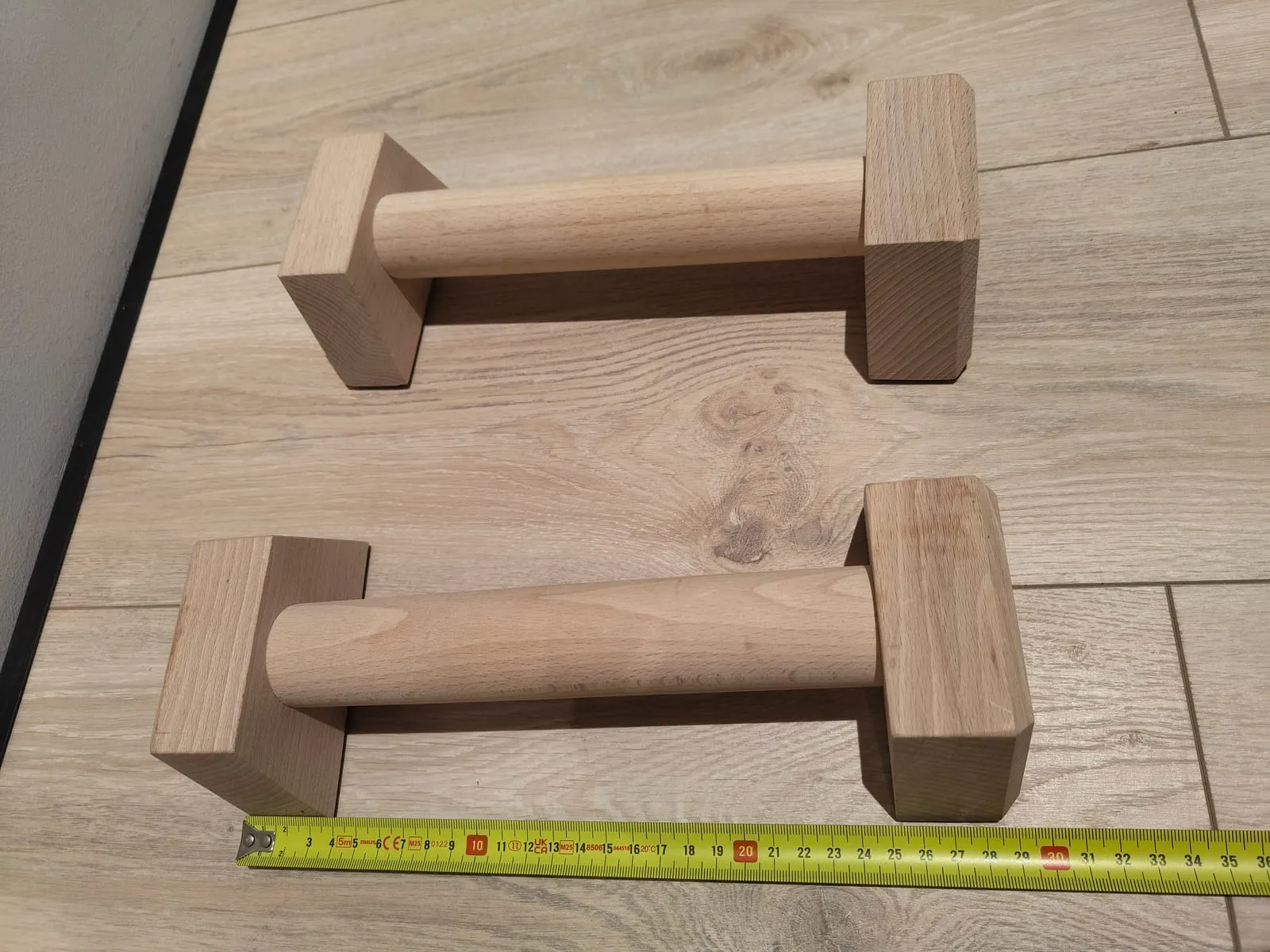 The parallettes next to a ruler